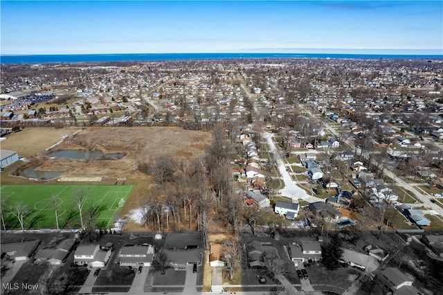 birds eye view of property featuring a water view and a residential view