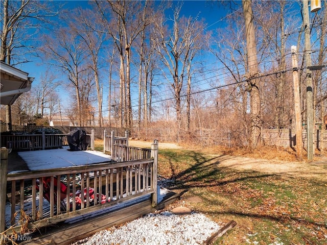 view of yard featuring a deck and fence