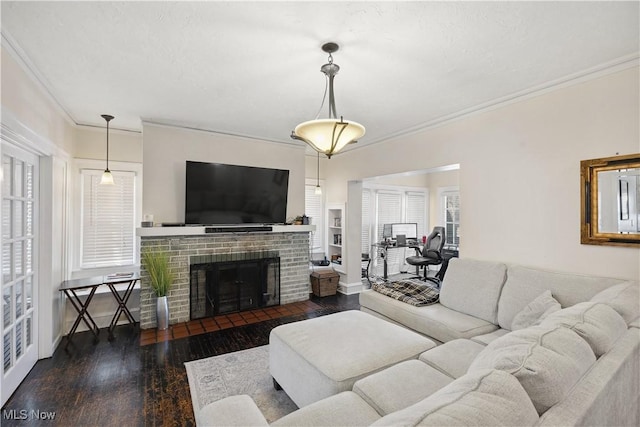 living room featuring hardwood / wood-style floors, a fireplace, and ornamental molding