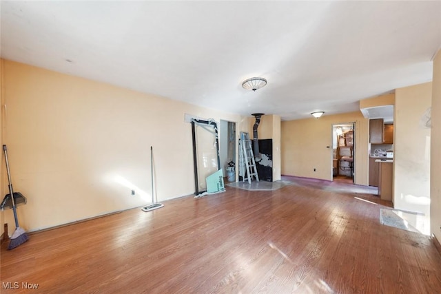 unfurnished living room with light wood-type flooring