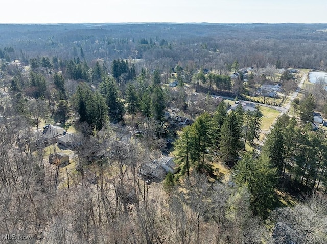 bird's eye view featuring a wooded view