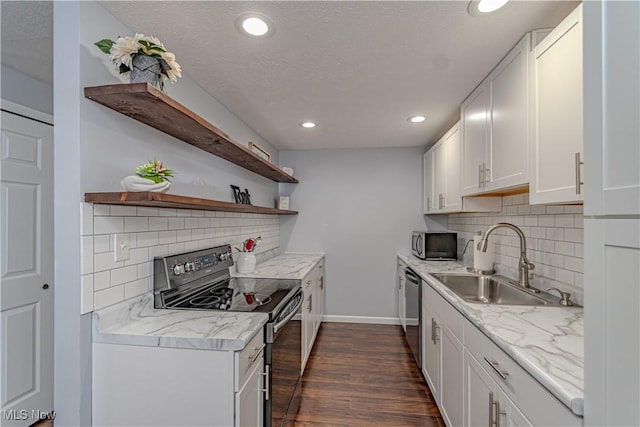 kitchen with open shelves, recessed lighting, dark wood-style floors, stainless steel appliances, and a sink