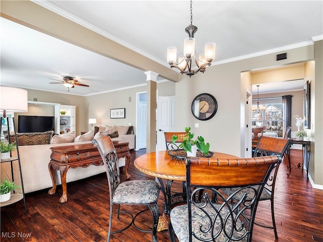 dining area with ceiling fan with notable chandelier, dark wood-style flooring, and ornamental molding