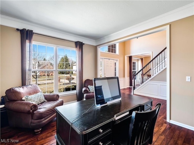 office space with a decorative wall, a wainscoted wall, crown molding, and dark wood-type flooring