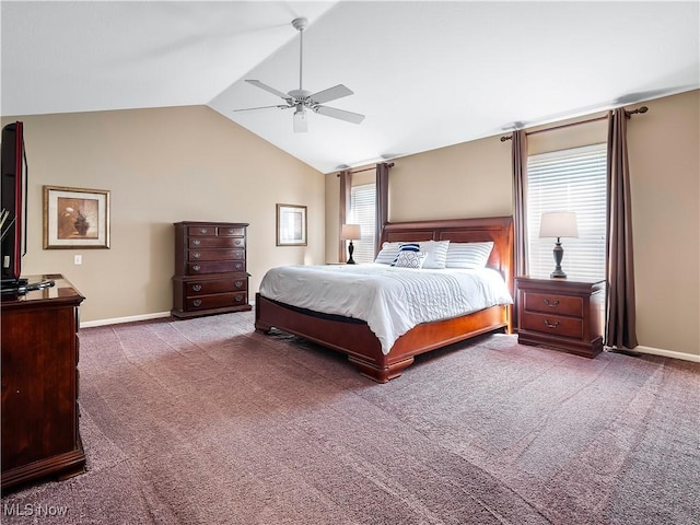 carpeted bedroom featuring baseboards, lofted ceiling, and a ceiling fan