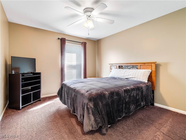 carpeted bedroom with baseboards and ceiling fan