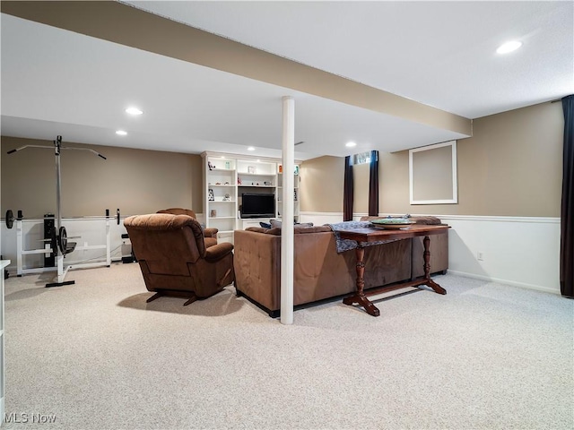 living room featuring recessed lighting, baseboards, and carpet flooring