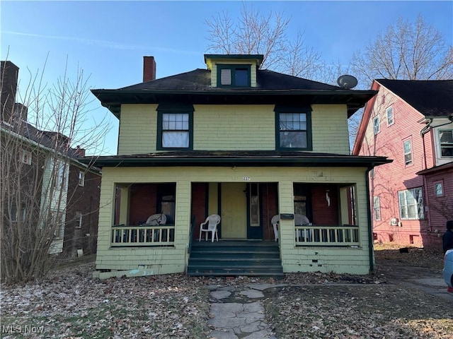 traditional style home with covered porch and crawl space