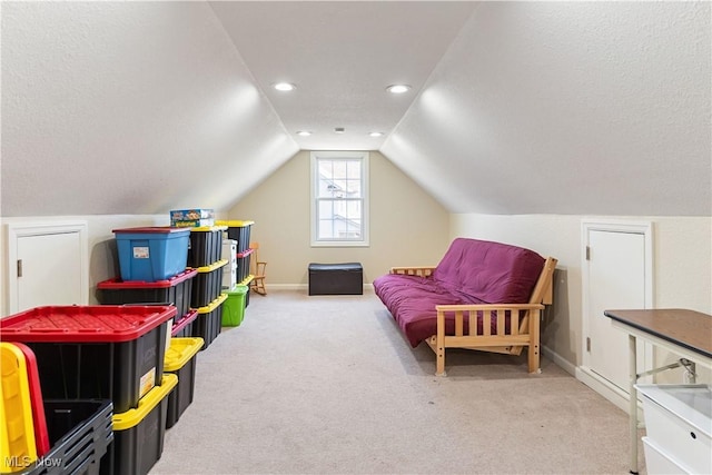 playroom featuring a textured ceiling, recessed lighting, carpet flooring, baseboards, and vaulted ceiling