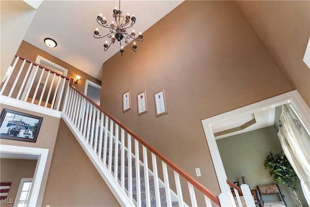 staircase with a high ceiling