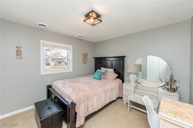 bedroom with light colored carpet, visible vents, and baseboards