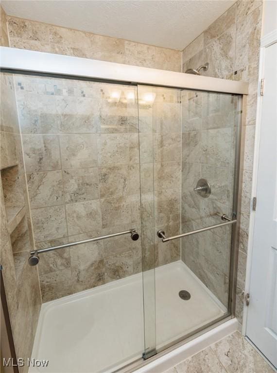 bathroom featuring a stall shower