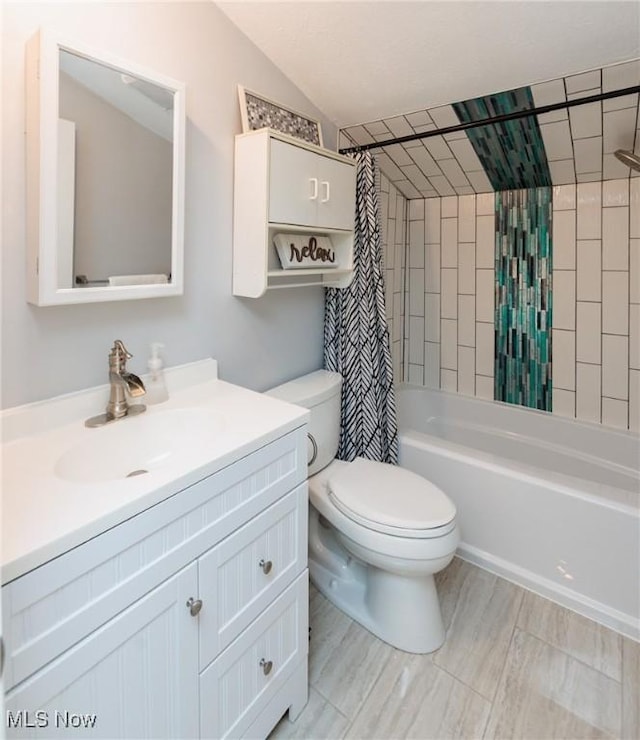 bathroom featuring vanity, vaulted ceiling, toilet, and shower / bath combo