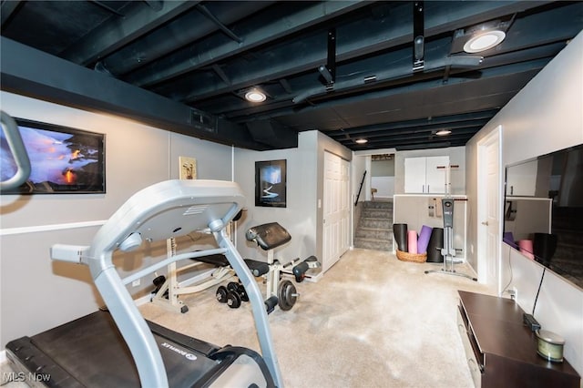 workout area featuring carpet flooring