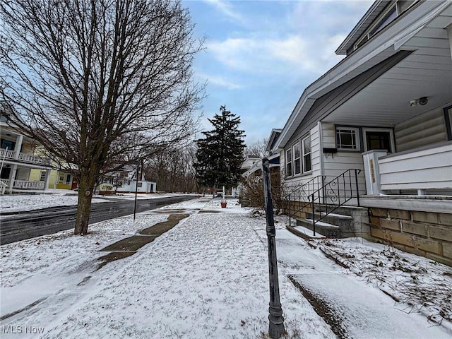 view of yard covered in snow