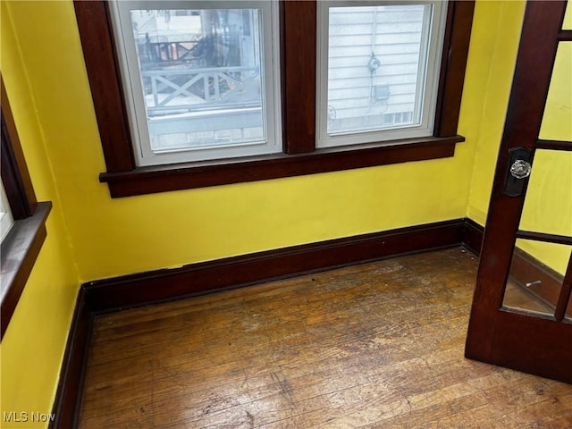 spare room with baseboards