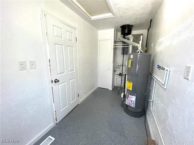 utility room featuring water heater