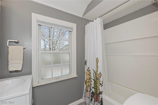 full bath with vanity, shower / tub combo, and toilet