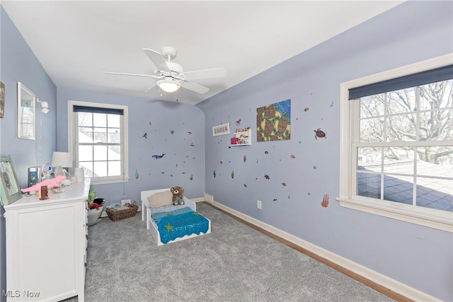 carpeted bedroom with baseboards and ceiling fan