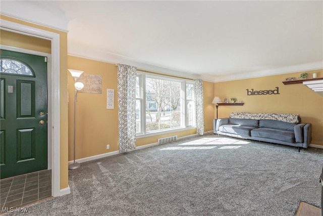 living area featuring visible vents, carpet floors, baseboards, and ornamental molding