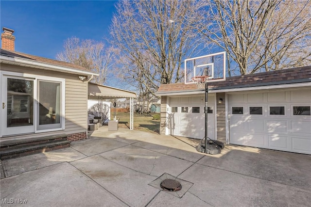 exterior space featuring an outbuilding and a garage