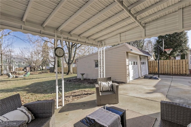 view of patio / terrace with an outdoor structure and fence