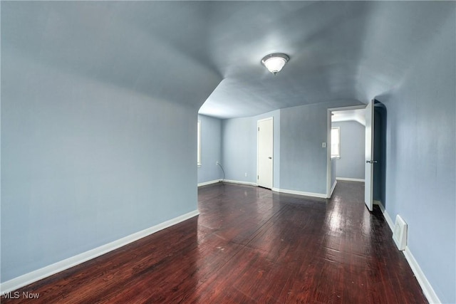 interior space with baseboards and hardwood / wood-style floors