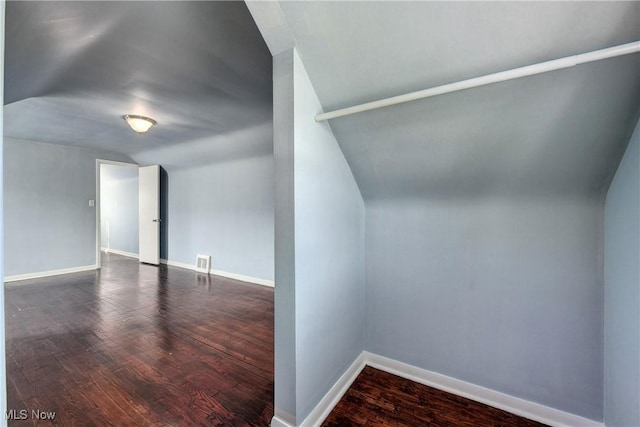 bonus room featuring visible vents, baseboards, and wood finished floors