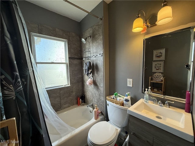 bathroom with vanity, toilet, and shower / tub combo