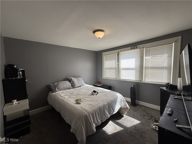 carpeted bedroom featuring baseboards