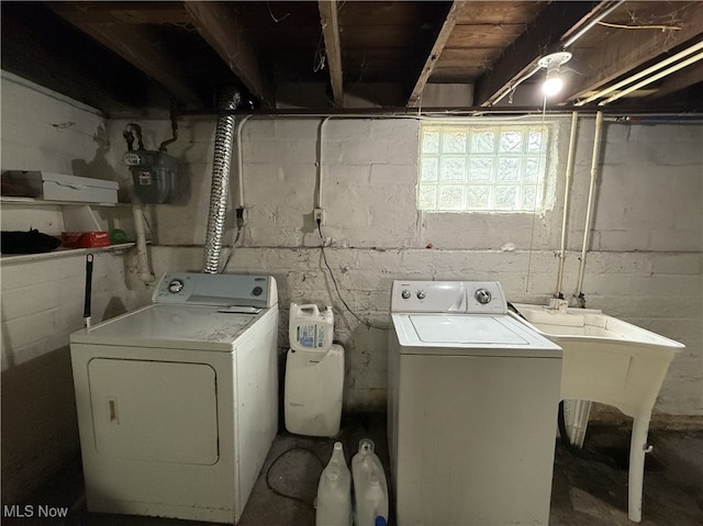 laundry room with separate washer and dryer and laundry area