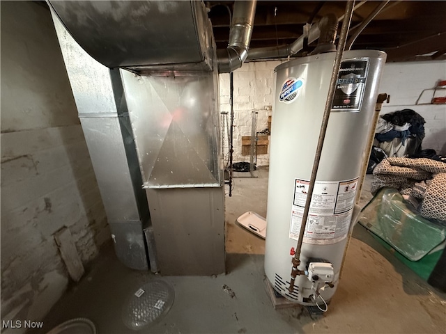 utility room with heating unit and water heater