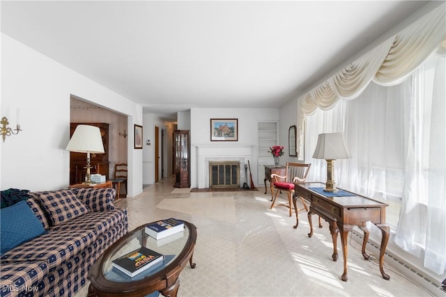 living room featuring a fireplace with flush hearth and a baseboard heating unit