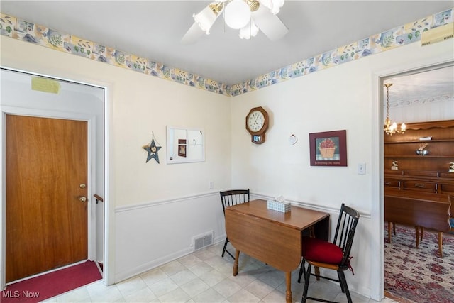 dining room featuring visible vents and ceiling fan with notable chandelier