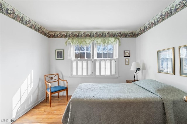 bedroom featuring light wood finished floors