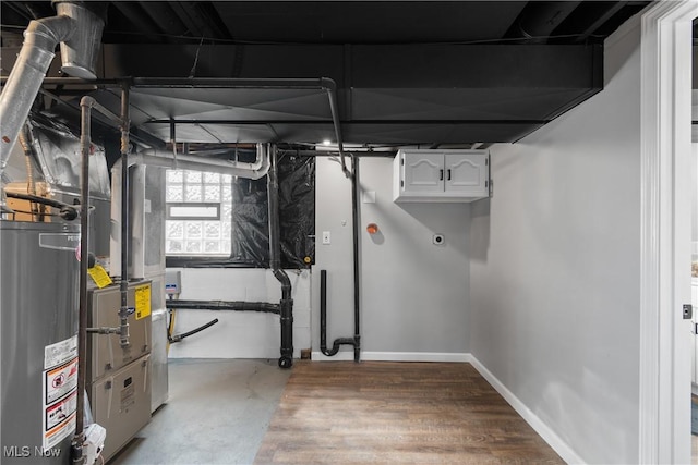 utility room with gas water heater