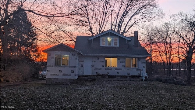 view of front of home featuring a chimney