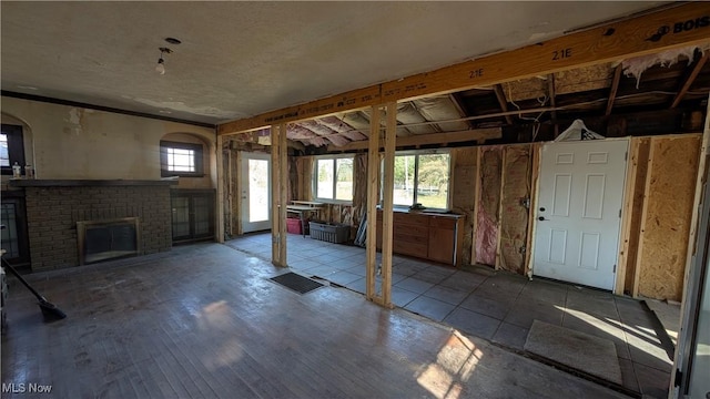 basement with a brick fireplace