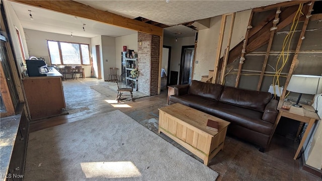 living room with beam ceiling