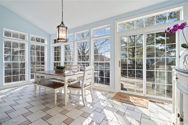 sunroom featuring lofted ceiling