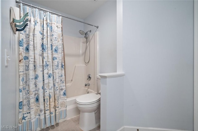 bathroom featuring tile patterned floors, toilet, and shower / bath combo with shower curtain