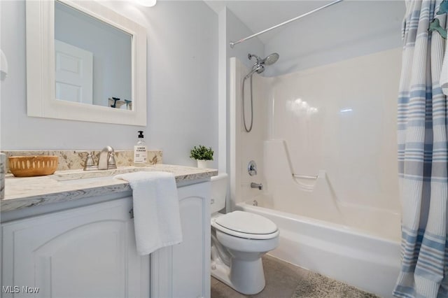 full bathroom with shower / tub combo with curtain, vanity, and toilet