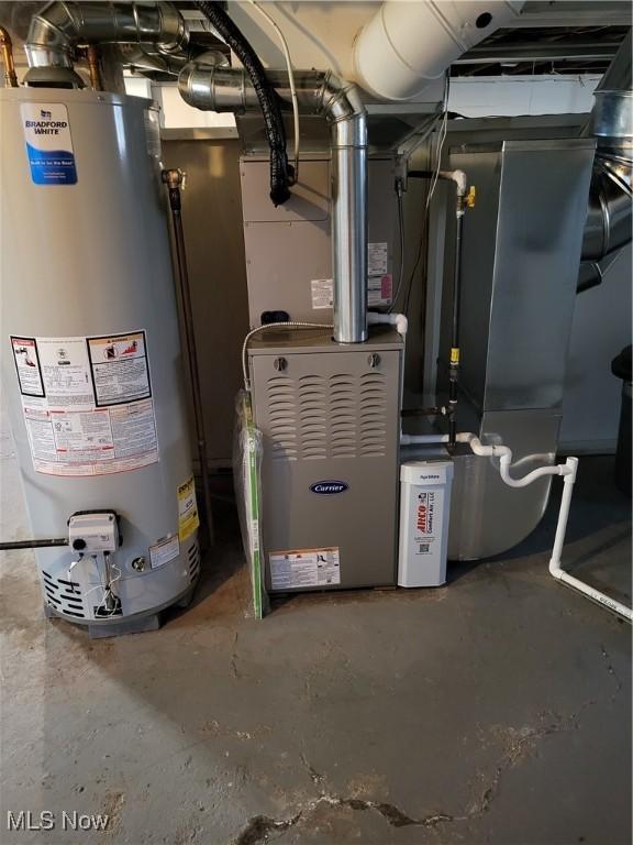 utility room featuring water heater