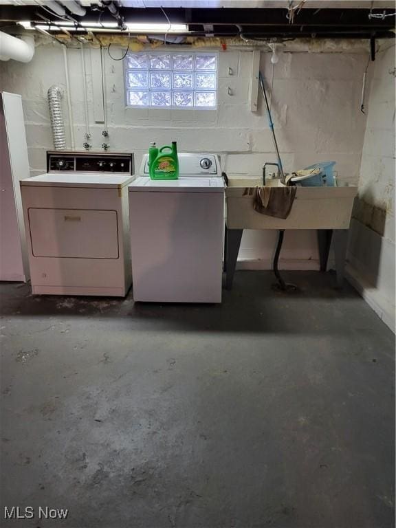 below grade area with washer and clothes dryer