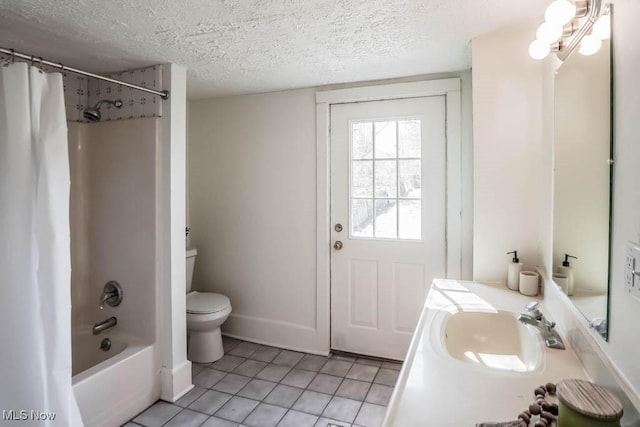 bathroom with vanity, shower / bath combo, tile patterned flooring, a textured ceiling, and toilet