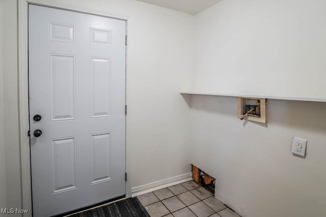 laundry area featuring light tile patterned floors, laundry area, and washer hookup