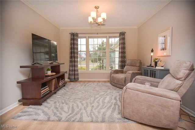 living area with baseboards, wood finished floors, and crown molding