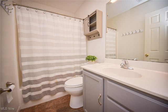 full bath featuring vanity, shower / tub combo, and toilet