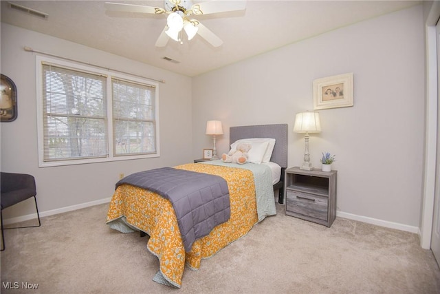 bedroom with carpet flooring, baseboards, and visible vents