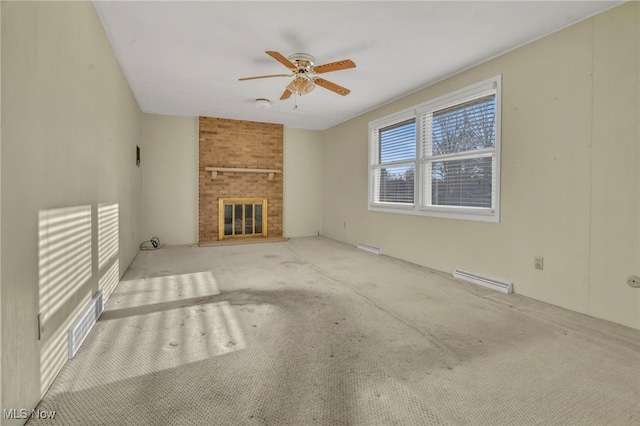 unfurnished living room featuring visible vents, a ceiling fan, a baseboard heating unit, a fireplace, and carpet flooring